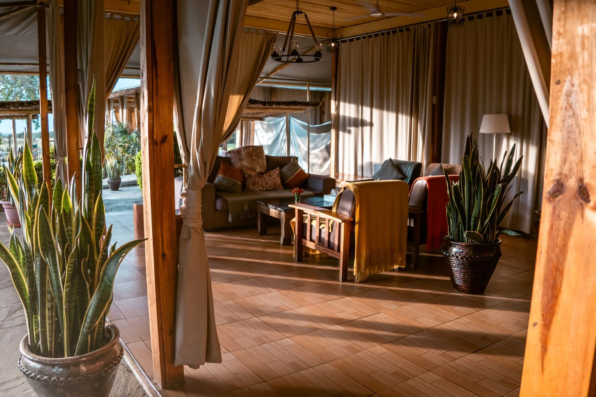 IM_KE_MAR_Zebra-Plains-Mara-Camp_seating-area-with-the-sun.webp